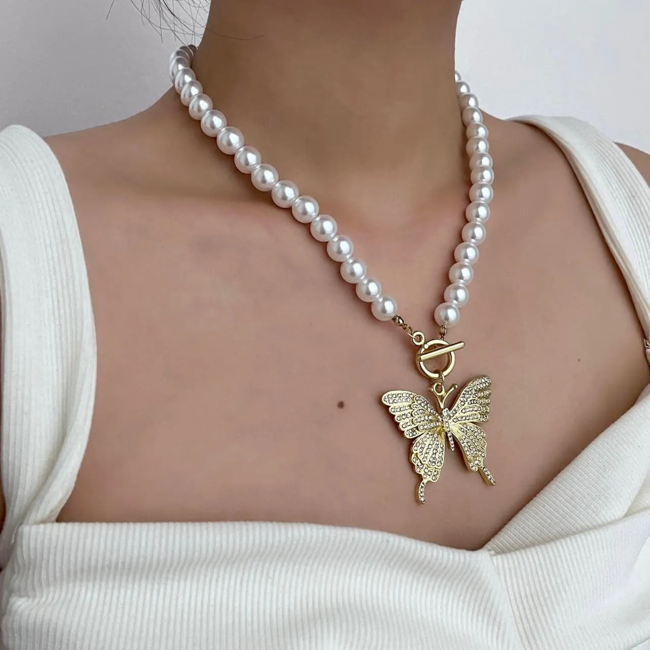 Faux pearl beaded butterfly pendant necklace