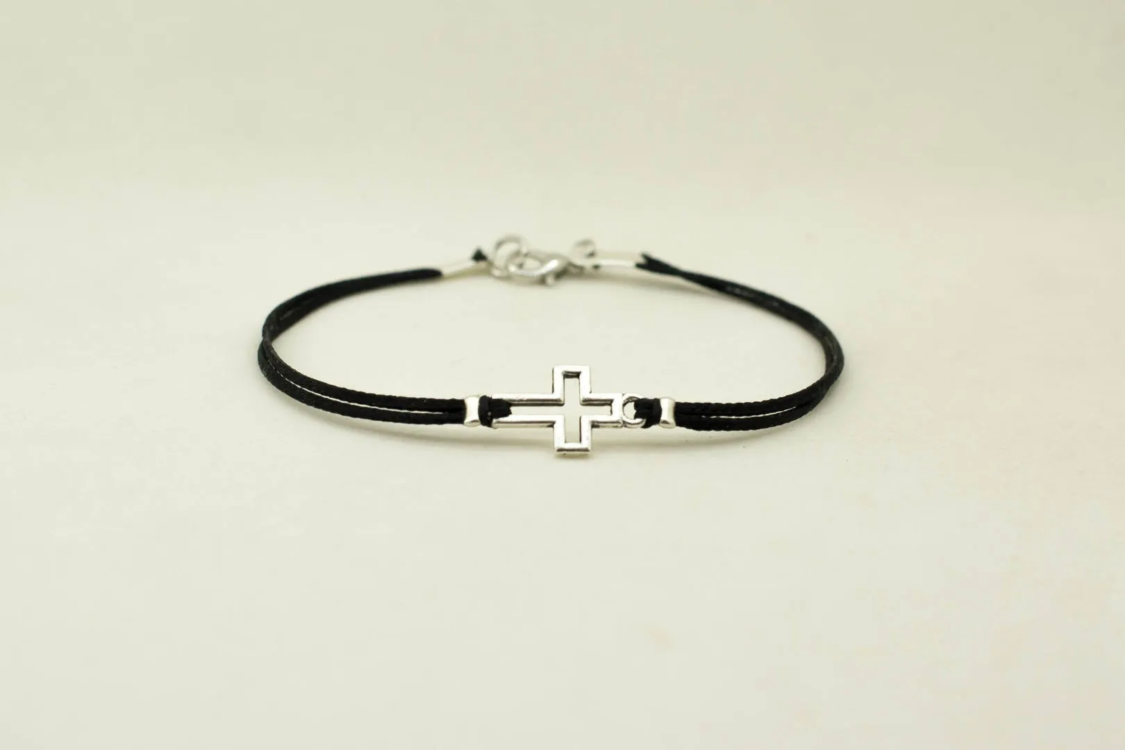 Men's bracelet with silver outline cross pendant, black cord, Christian gift for him